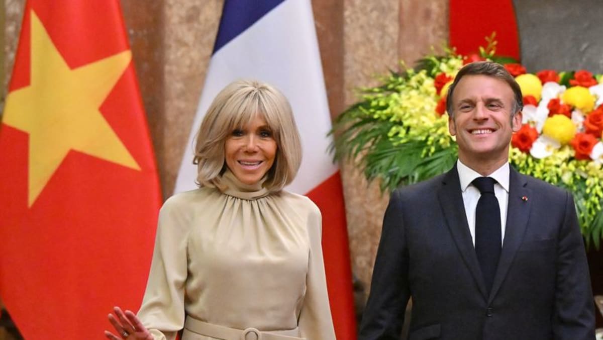 Macron plays down apparent shove from wife in Vietnam