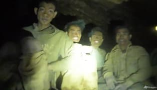 Rescuers evacuate the first of 5 villagers found trapped in a cave in Laos; 2 still missing