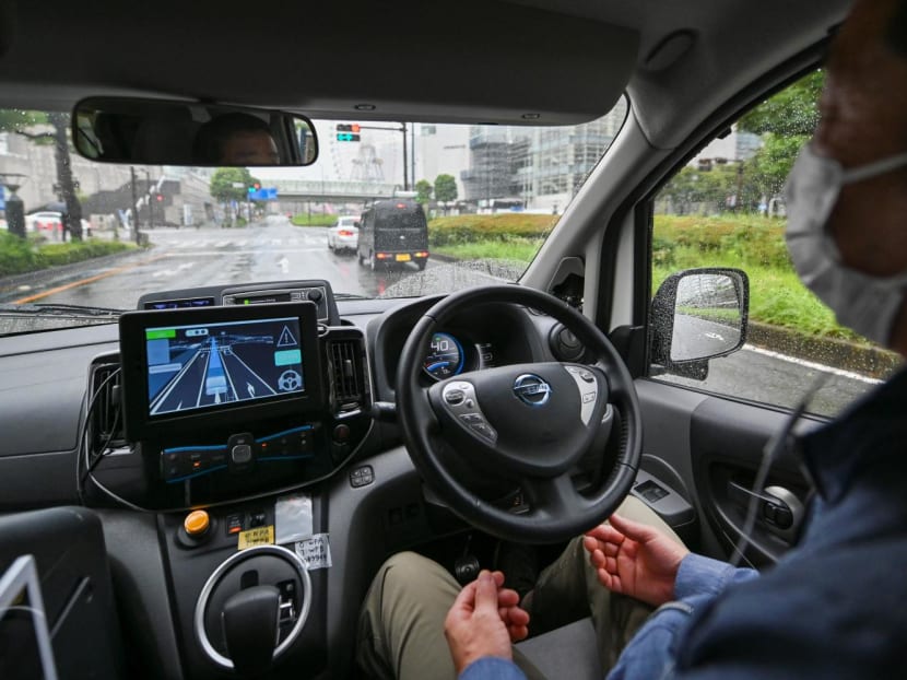 This file picture taken on Sep 9, 2021 shows a Nissan Motor staff member with his hands off the steering wheel while seated in the driver's seat of the company's autonomous vehicle, during a press preview for a field operation test of Easy Ride, a driverless mobility service in Yokohama, Kanagawa prefecture. This file picture taken on Sep 9, 2021 shows a Nissan Motor staff member with his hands off the steering wheel while seated in the driver's seat of the company's autonomous vehicle, during a press preview for a field operation test of Easy Ride, a driverless mobility service in Yokohama, Kanagawa prefecture.