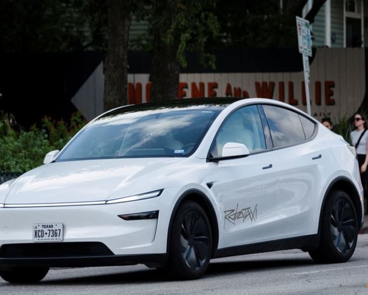 Tesla profit falls short despite record sales, hit by higher costs and fading credits