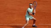 Ruud recovers from Rome mauling for winning start at French Open