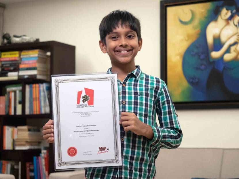 Siddharth Arya Ravulaparthi, 12, holds up his Singapore book of records certificate for reciting the most digits of the Pi mathematical constant. Siddharth Arya Ravulaparthi, 12, holds up his Singapore book of records certificate for reciting the most digits of the Pi mathematical constant.