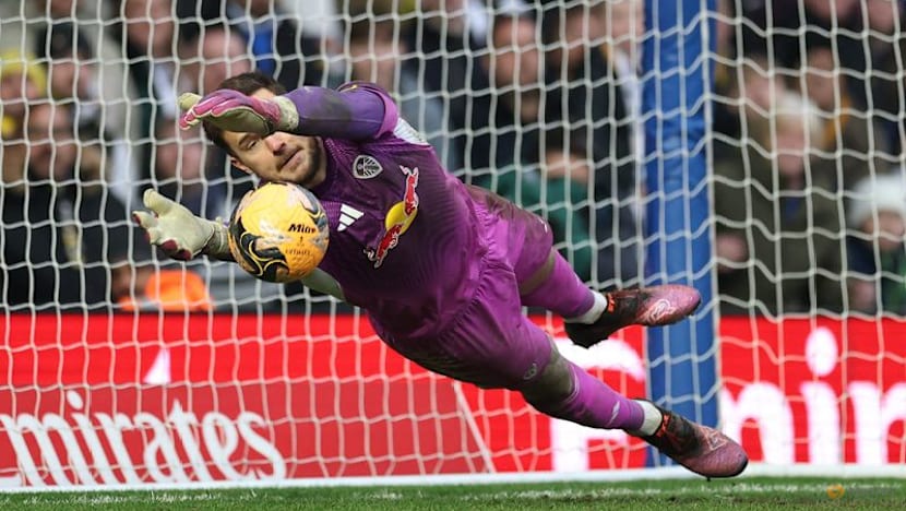 Arsenal stroll to Wigan win as Leeds beat Birmingham, Wolves survive Grimsby mud bath