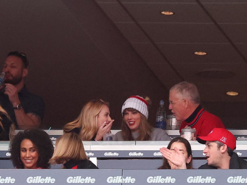 Brittany Mahomes, Taylor Swift, and Scott Kingsley Swift talk while the Kansas City Chiefs and the New England Patriots play at Gillette Stadium on Dec 17, 2023 in Foxborough, Massachusetts. 