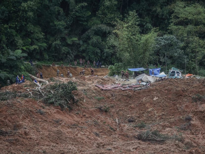 Malaysia authorities inspect the site damaged after a landslide in Batang Kali, Selangor on Dec 16, 2022. Malaysia authorities inspect the site damaged after a landslide in Batang Kali, Selangor on Dec 16, 2022.