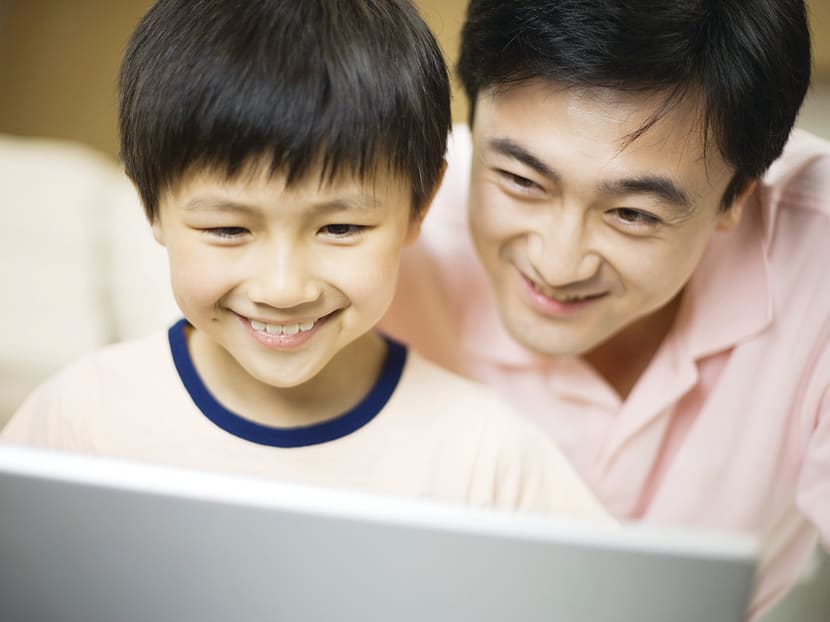Father and Son Using Laptop. Photo: Thinkstock