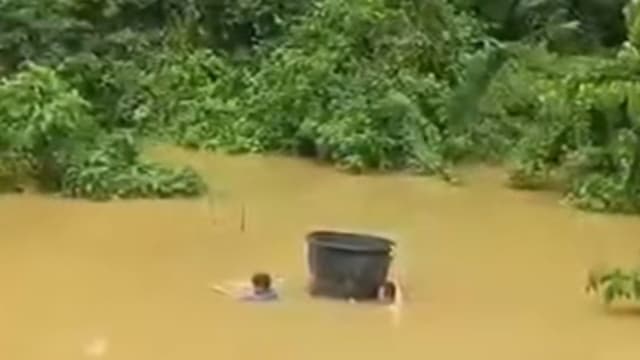 考生洪水中游泳赴考引议 马国教育部安置住宿舍