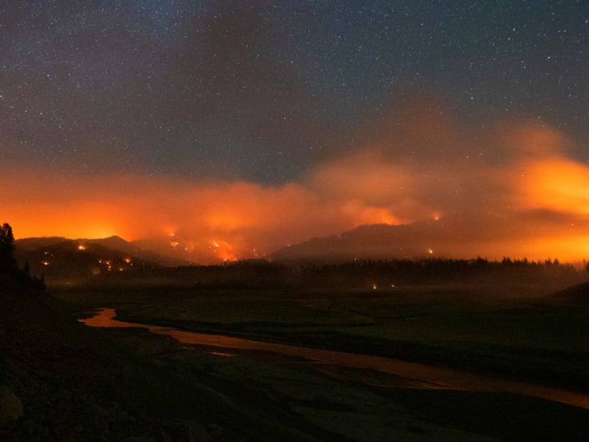 In this long exposure photograph, flames surround a drought-stricken Shasta Lake during the "Salt fire" in Lakehead, California early on July 2, 2021, as firefighters battle nearly a dozen wildfires in the region following a heatwave and multiple lightning strikes. In this long exposure photograph, flames surround a drought-stricken Shasta Lake during the "Salt fire" in Lakehead, California early on July 2, 2021, as firefighters battle nearly a dozen wildfires in the region following a heatwave and multiple lightning strikes.