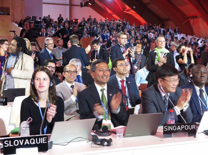 Dr Vivian Balakrishnan (second from left) and Chief Negotiator Mr Kwok Fook Seng (third from left) applauding at the Paris Climate Conference. Photo: Dr Vivian Balakrishnan/Facebook Dr Vivian Balakrishnan (second from left) and Chief Negotiator Mr Kwok Fook Seng (third from left) applauding at the Paris Climate Conference. Photo: Dr Vivian Balakrishnan/Facebook