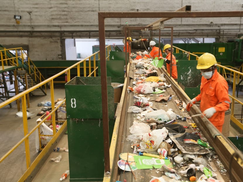 Recyclables are sorted at Sembcorp’s Materials Recovery Facility in Tuas, but contaminated or unrecyclable items such as wet plastics, food waste and drinks make up a whopping 40 per cent of what is collected.