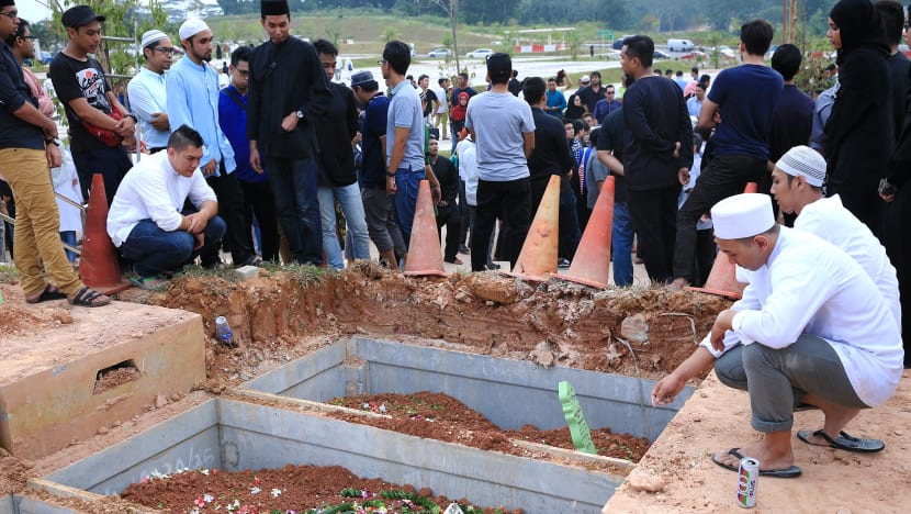 2 SMRT staff killed in accident laid to rest beside each other