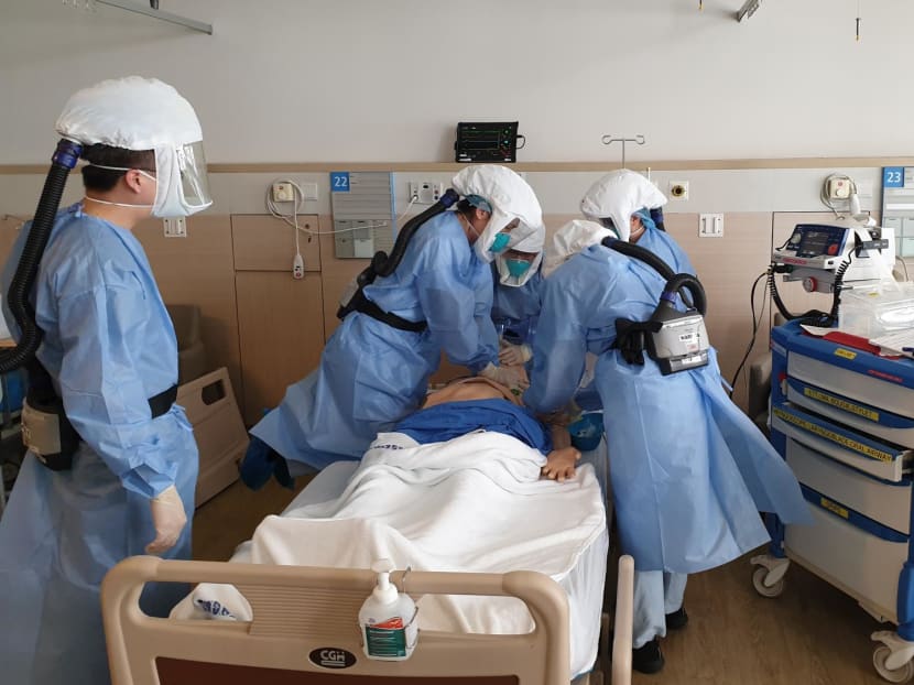Ms Mashithah Mansor, a nurse clinician from Changi General Hospital, undergoing simulation training on emergency resuscitation with colleagues from a medical emergency team during the Covid-19 pandemic.
Ms Mashithah Mansor, a nurse clinician from Changi General Hospital, undergoing simulation training on emergency resuscitation with colleagues from a medical emergency team during the Covid-19 pandemic.