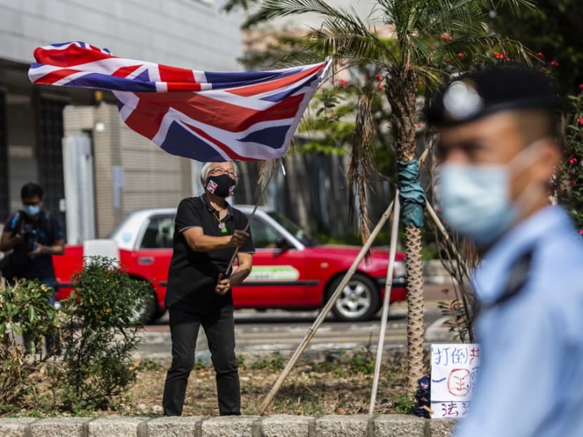 Pro-democracy activist Alexandra Wong, also known as Grandma Wong, waves a British Union Jack flag outside West Kowloon court in Hong Kong on April 1, 2021.
