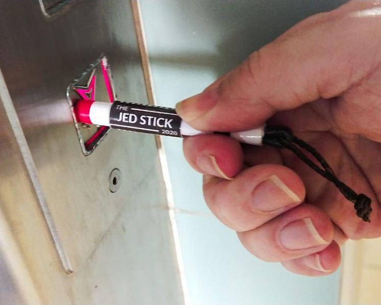 Student designs retractable paper stick to press lift buttons, uploads template for users to make their own