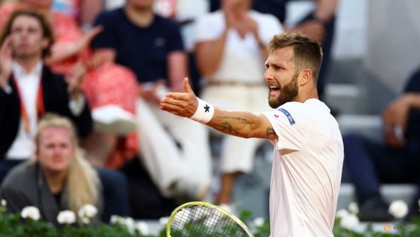 Djokovic saves set point, battles past Moutet to stay on course for record Grand Slam