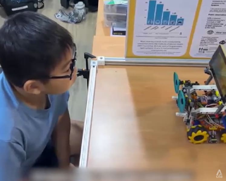 Two Singapore primary schoolers invent robot to help kids keep a safe distance from screens