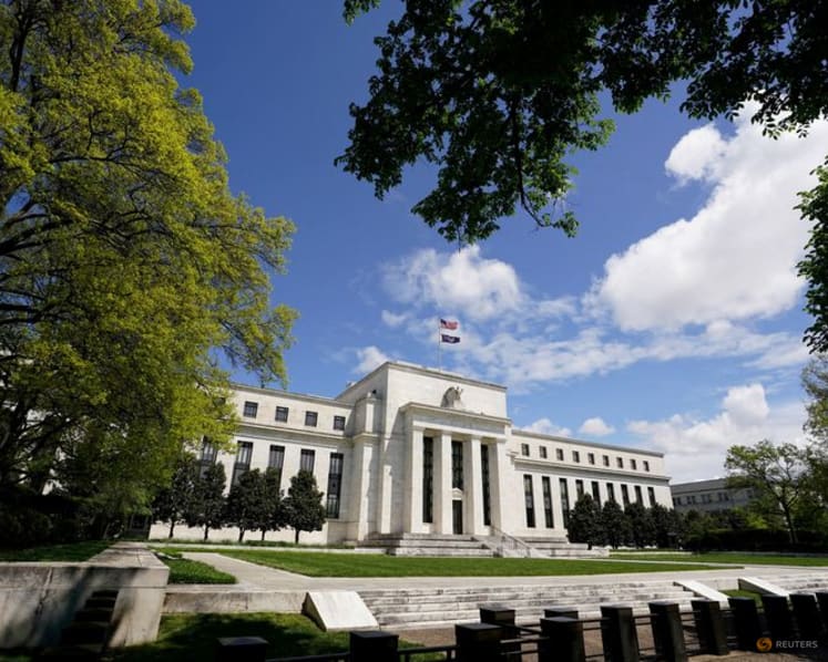 Dollar slips as Fed holds rates steady