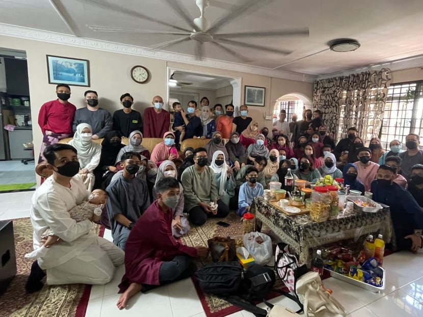 Mr Muhammad Ridhwan Ismail Johari, 28, (top left, in red) with his family and relatives gathering at his granduncle’s Kaki Bukit home for Hari Raya Puasa on May 3, 2022. Mr Muhammad Ridhwan Ismail Johari, 28, (top left, in red) with his family and relatives gathering at his granduncle’s Kaki Bukit home for Hari Raya Puasa on May 3, 2022.