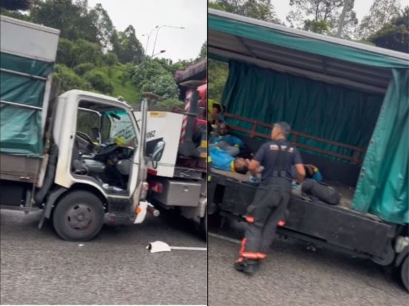 A screengrab of the accident site showing one of the lorries crashing against the back of another (left) and a few men being attended to by SCDF officers (right).