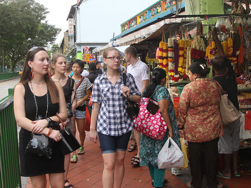 Tourists seen around Little India on 19 Dec 2013. Photo by OOI BOON KEONG