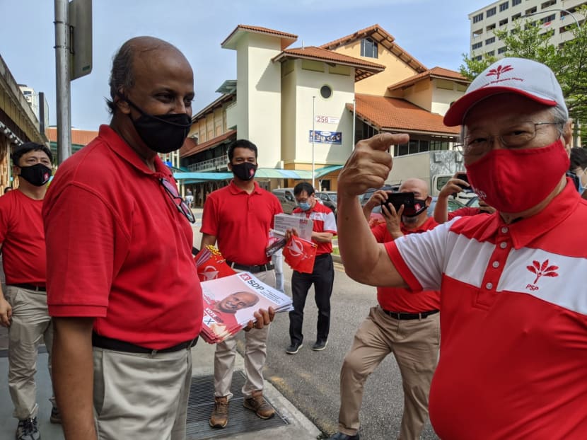 SDP chairman Paul Tambyah (second from left) and PSP chief Tan Cheng Bock (right) met on Tuesday (July 7) morning as Dr Tan joined Dr Tambyah on a walkabout in Bukit Panjang.