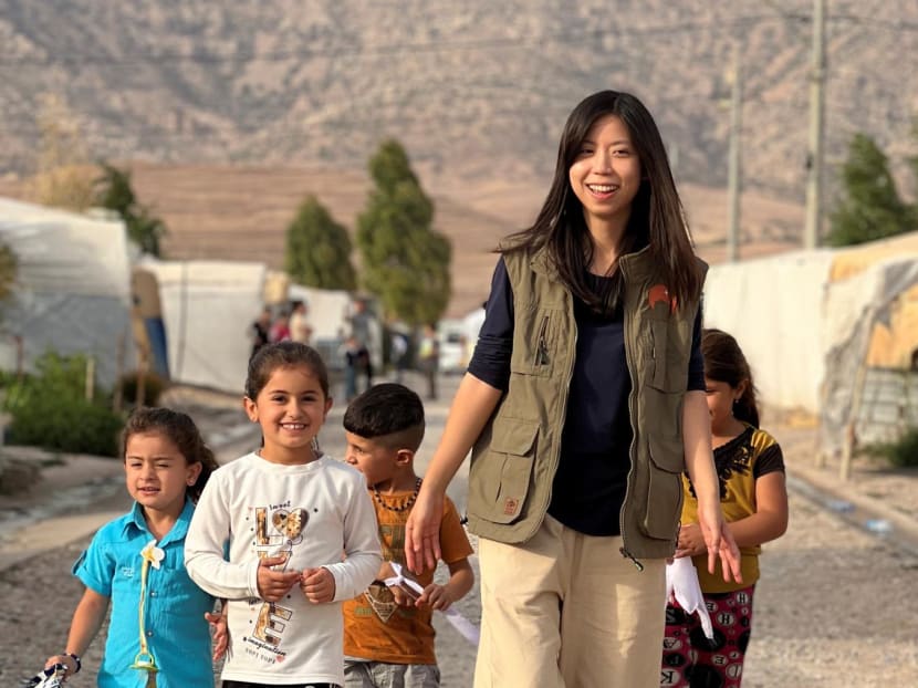 Ms Heidi Tan, director of operations at Habibi International, a humanitarian organisation founded by Singaporean Willy Tan. She is pictured with children from a refugee camp for Yazidis in northern Iraq.