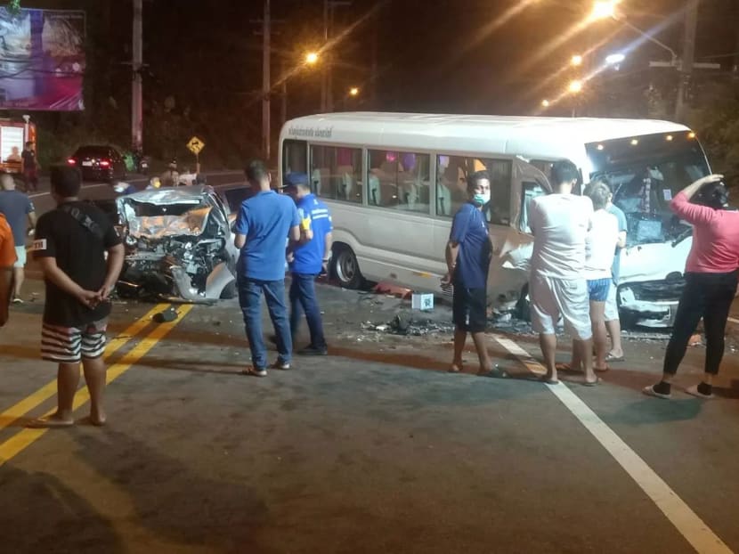 Rescue workers prepare to take the people injured in a crash between a car and a tour bus to hospitals in Karon area, Phuket, on Aug 12, 2022.