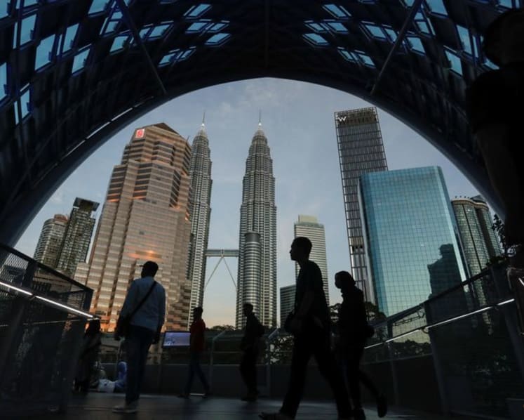 Malaysia growth near forecast in second quarter, but central bank flags tariff uncertainty