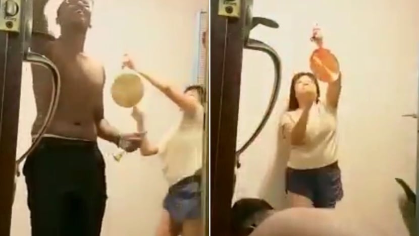 Police investigating viral video of woman banging a gong while neighbour was performing prayer ritual