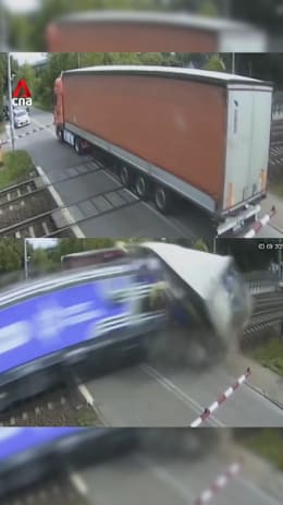 Train crashes through truck trailer in Poland; Train driver taken to hospital