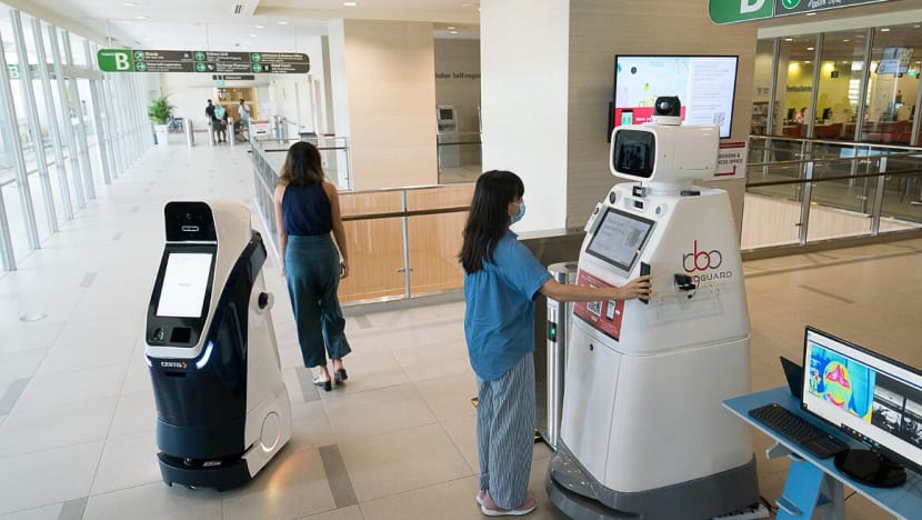 Robots that do SafeEntry and temperature checks, touch-free lifts among new technology adopted by NUHS hospitals