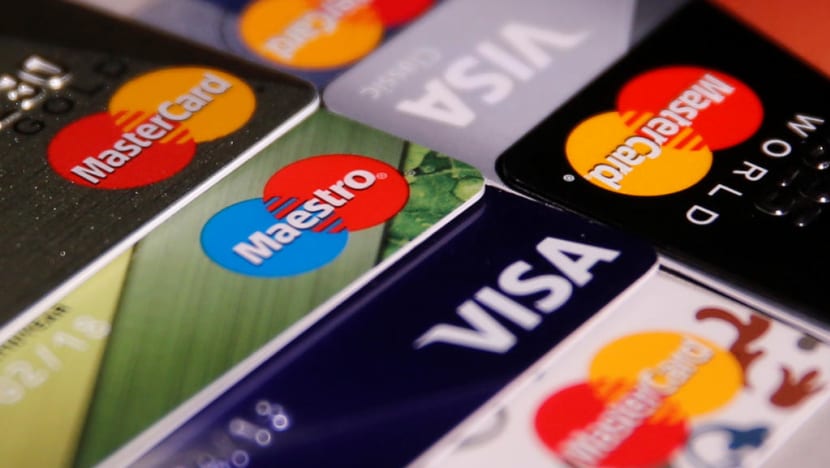 Woman fined S$6,000 for using firm’s debit card to shop online, get meals and Grab rides