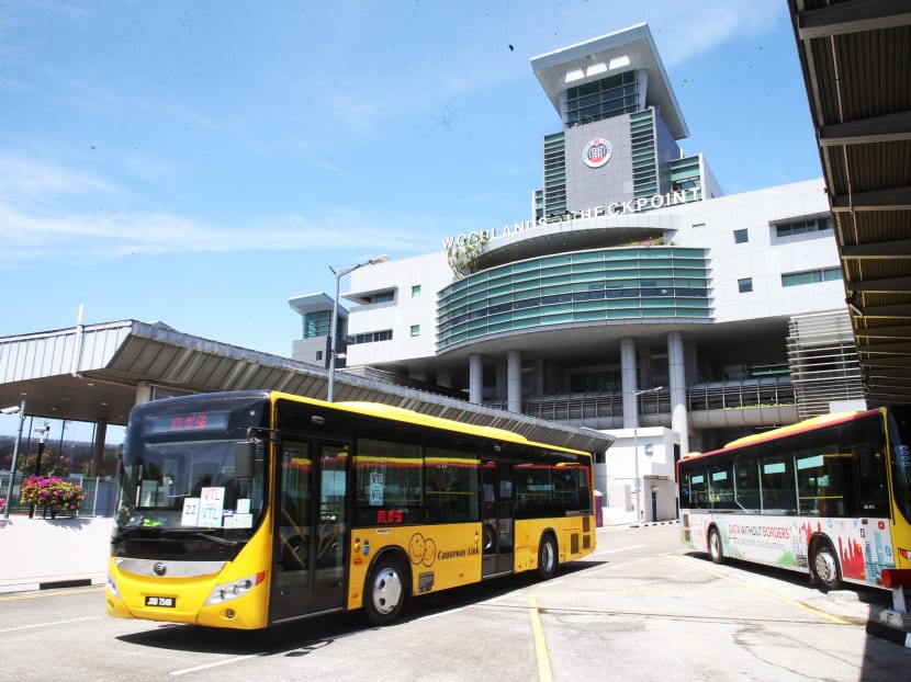 A bus operated by Causeway Link travel agency under the vaccinated travel lane scheme, leaving Woodlands Checkpoint in Singapore. A bus operated by Causeway Link travel agency under the vaccinated travel lane scheme, leaving Woodlands Checkpoint in Singapore.