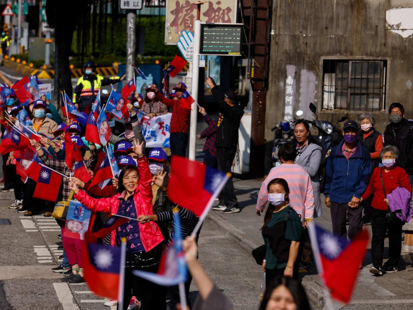 Supporters of Mr Hou Yu-ih, a candidate for Taiwan's presidency from the main opposition party Kuomintang (KMT), wait for him on the side of the street during a campaign event in New Taipei City, Taiwan on Jan 5, 2024. 