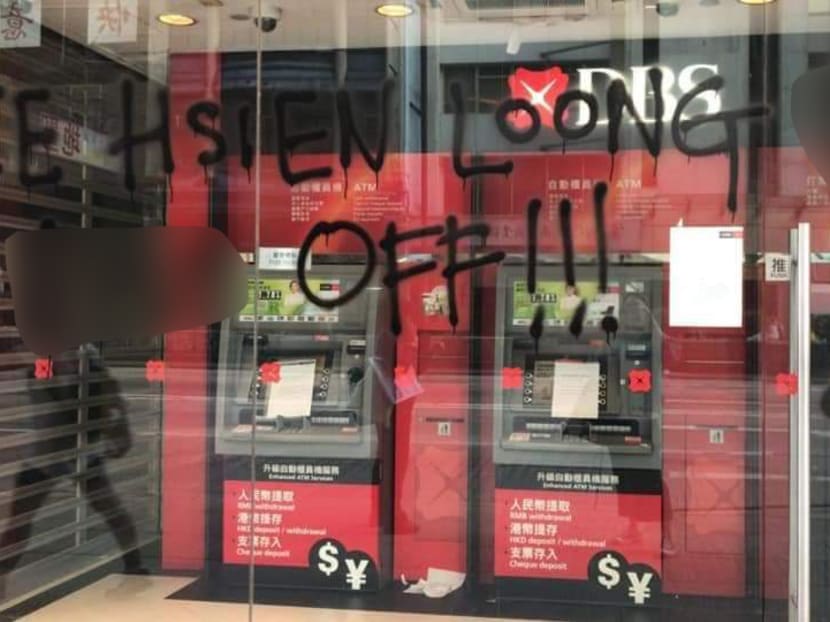 A photograph circulating on social media of graffiti at a DBS Bank branch in Hong Kong. TODAY has blurred out vulgarities. DBS said on Thursday the graffiti had been removed. A photograph circulating on social media of graffiti at a DBS Bank branch in Hong Kong. TODAY has blurred out vulgarities. DBS said on Thursday the graffiti had been removed.