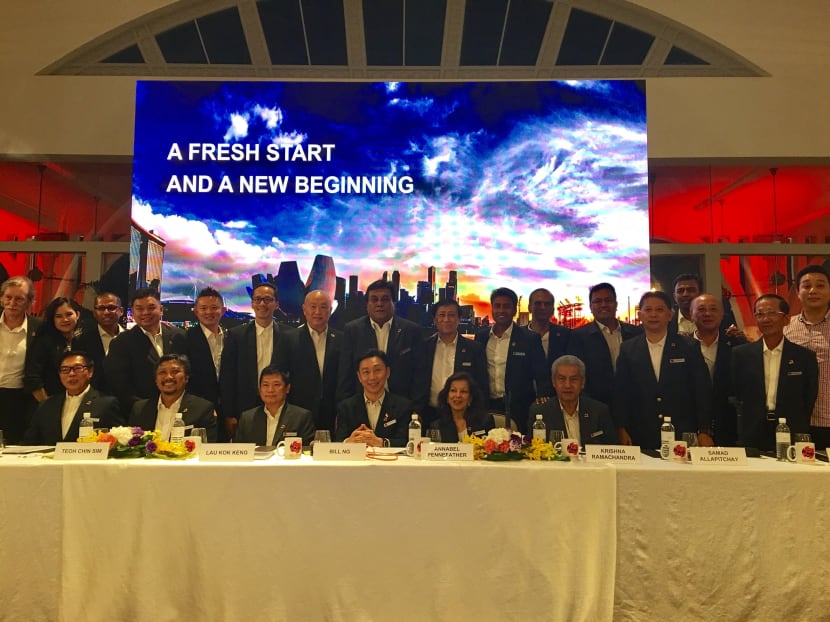 Bill Ng (front row, centre) with members of team Game Changers at the press conference at Fullerton Bay Hotel. Photo: Noah Tan