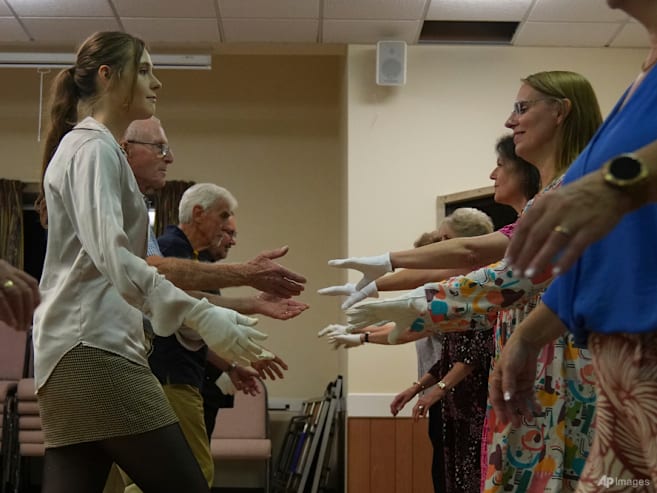 Jane Austen fans honour 250 years of the beloved author's birth with grand balls and dancing