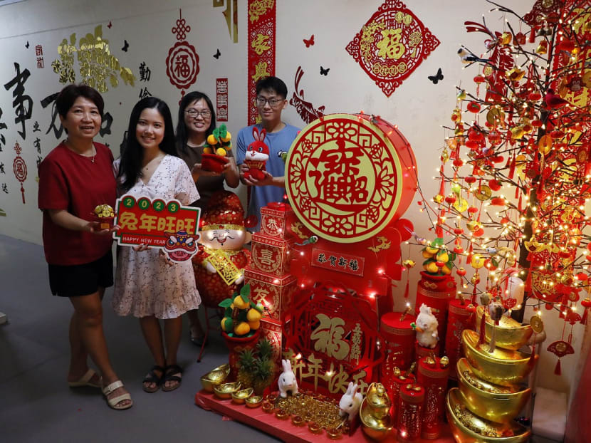 (L-R) Neighbours Madam Kim Yap, Ms Jasmine Ng, Ms May Siow and Mr Ong Zhen Kuang pose on Jan 16, 2023 with the Chinese New Year decorations they worked on together to put up along a section of corridor on the eighth floor of Blk 851, Woodlands Street 83. (L-R) Neighbours Madam Kim Yap, Ms Jasmine Ng, Ms May Siow and Mr Ong Zhen Kuang pose on Jan 16, 2023 with the Chinese New Year decorations they worked on together to put up along a section of corridor on the eighth floor of Blk 851, Woodlands Street 83.