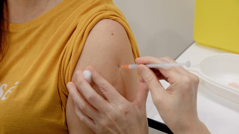 Firms may require workers in higher-risk settings to be vaccinated, but shouldn’t penalise unwilling employees: MOM