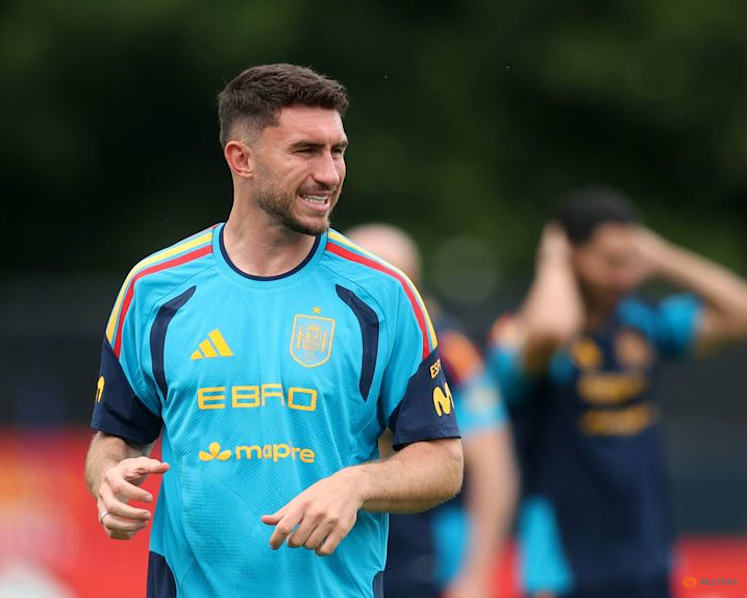 Unbeaten Spain ready for whatever Uruguay throw at them, Laporte says