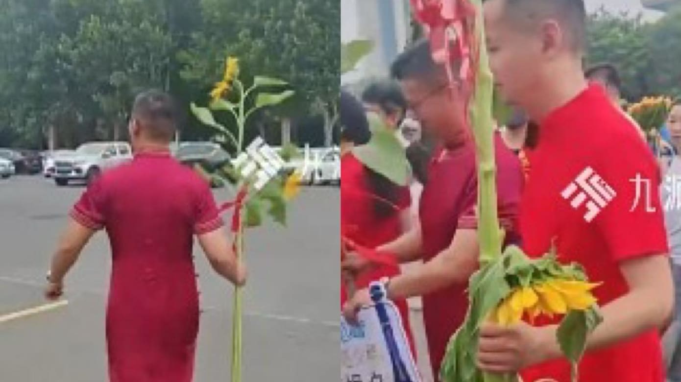 江苏父亲为高考孩子打气　穿旗袍到考场预祝“旗开得胜”