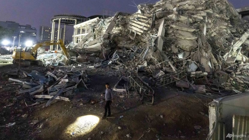 Thai construction magnate surrenders on felony negligence charges over building collapse in quake Thai construction magnate surrenders on felony negligence charges over building collapse in quake