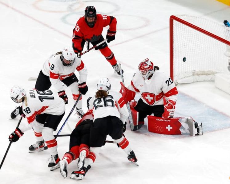 Ice hockey-Canada look to captain Poulin in title defence after goal-scoring record