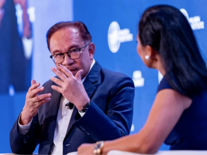 Malaysia Prime Minister Anwar Ibrahim speaking to Bloomberg anchor Haslinda Amin at the Milken Institute's Asia Summit in Singapore on Sept 13, 2023. )