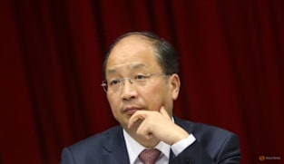 Former head of China securities watchdog Yi Huiman under corruption probe