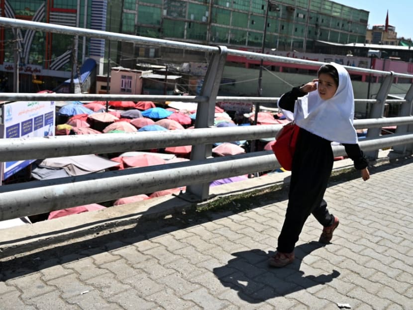 A school girl walks along a bridge at Kot-e Sangi area in Kabul on Sept 8, 2021.