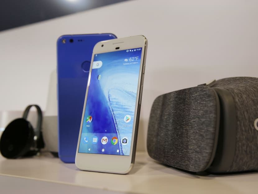 The new Google Pixel phone is displayed next to a Daydream View headset, right, following a product event Tuesday, Oct. 4, 2016, in San Francisco. Google launched an aggressive challenge to Apple and Samsung introducing its own new line of smartphones called Pixel, which are designed to showcase a digital helper the company calls "Google Assistant." Photo: AP