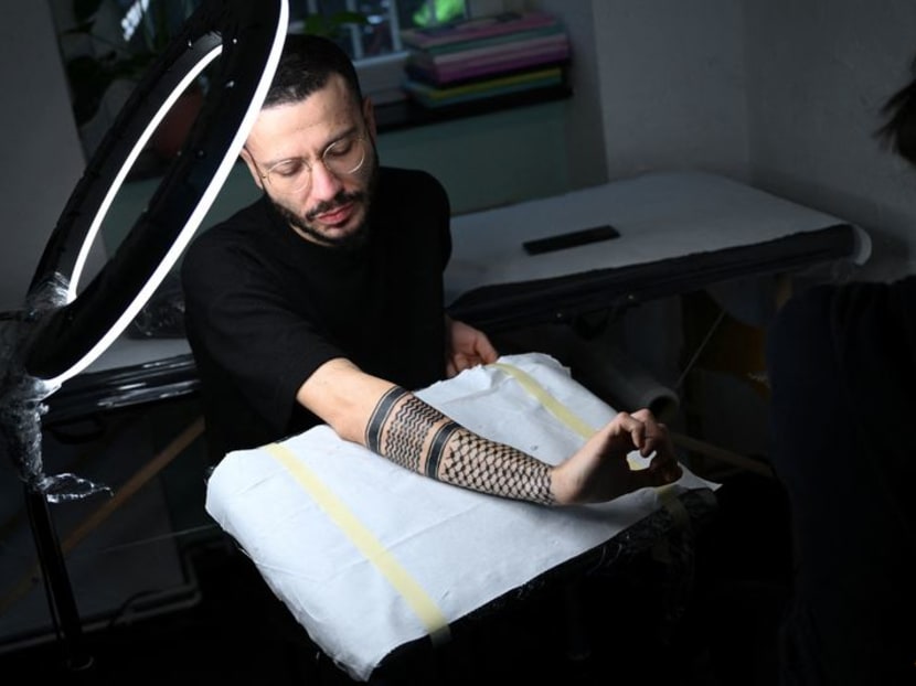 Palestinian keffiyeh scarves - a controversial symbol of solidarity