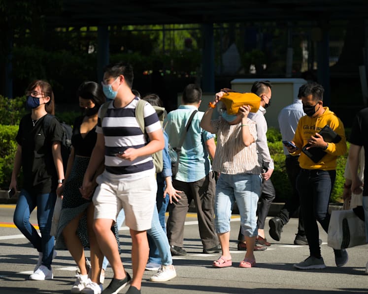Singapore reports a record 1,939 new COVID-19 cases, 2 more deaths