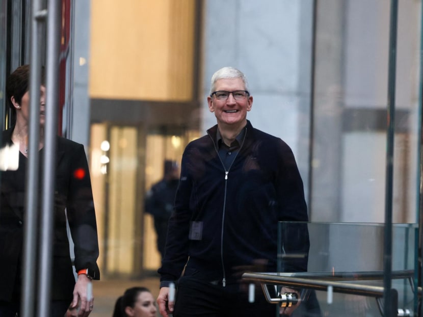 Apple CEO Tim Cook walks at the Apple Fifth Avenue store as customers queue to buy Apple's Vision Pro headset, in Manhattan in New York City, US, on Feb 2, 2024.